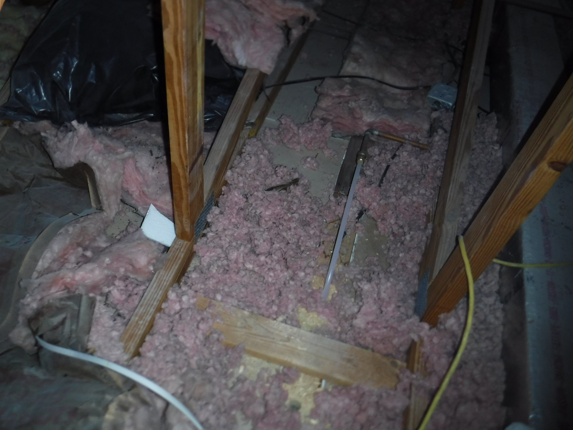 Insulation image, blown-in fiber insulation in attic