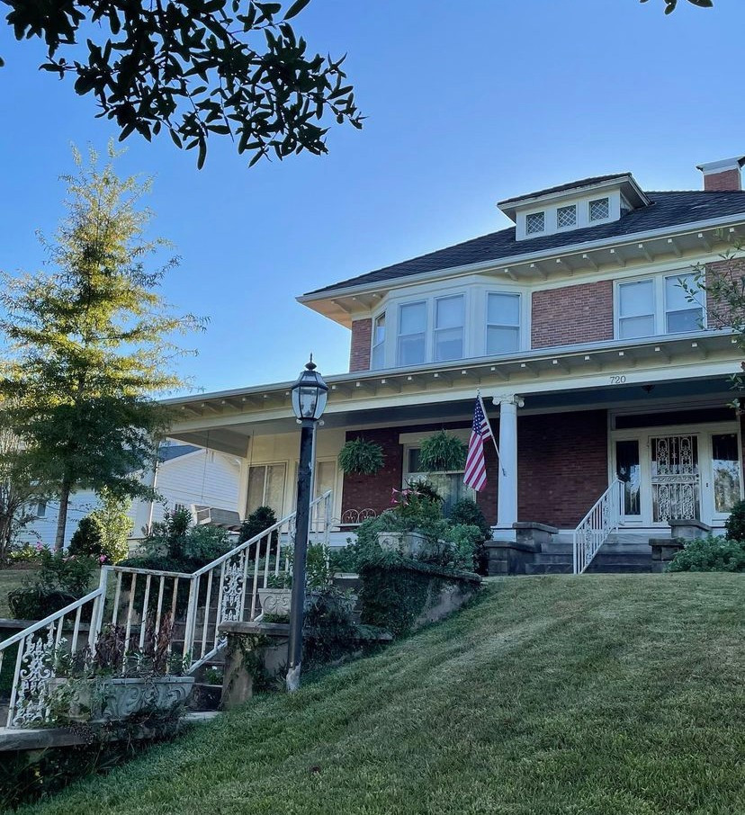 A beautiful brick two story home in Laurel with American Flag waving