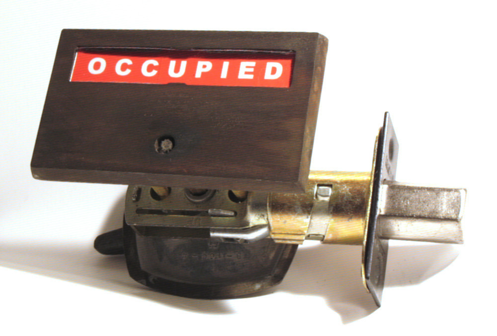 distressed brass indicator bathroom lock