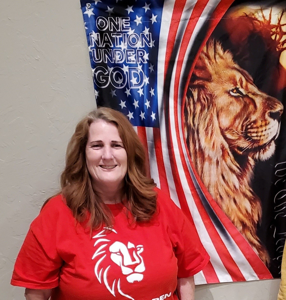 Ronda Peterson speaking at podium