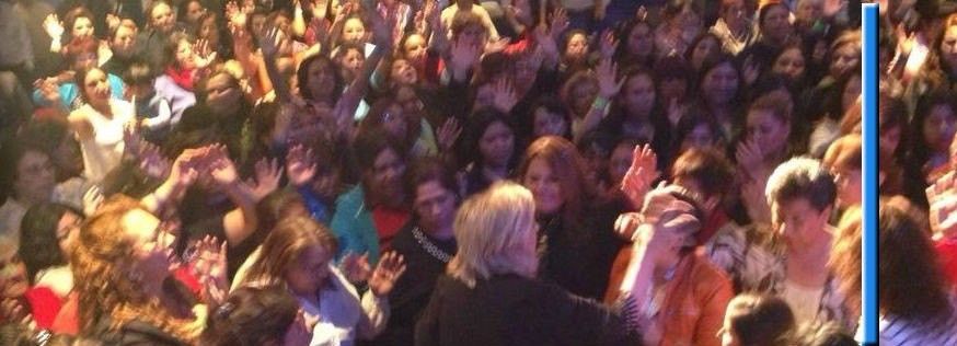 Dr. Kluane speaking to a large crowd