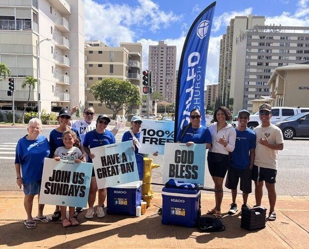 Outreach team with signs