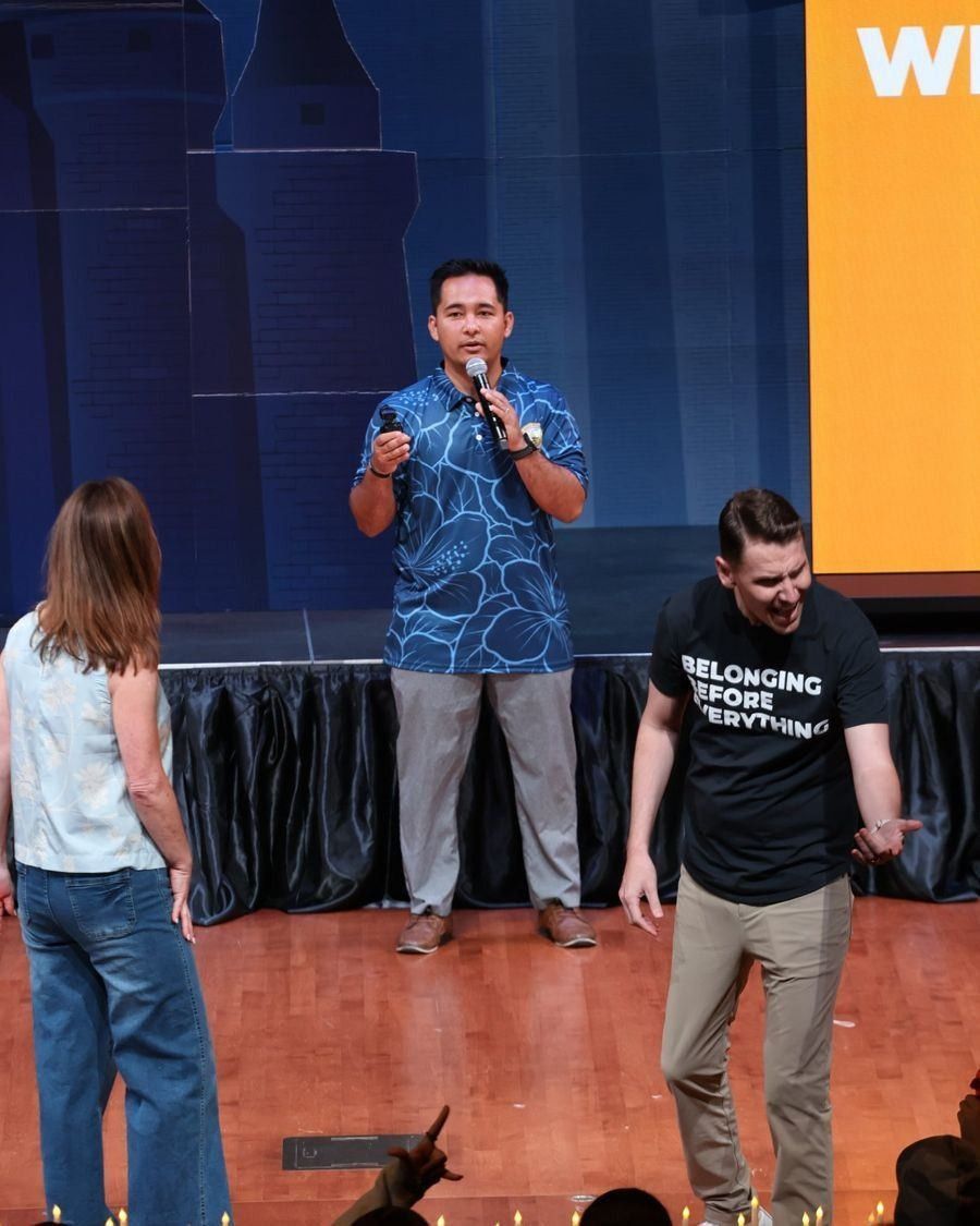 Speaker leading an activity on stage