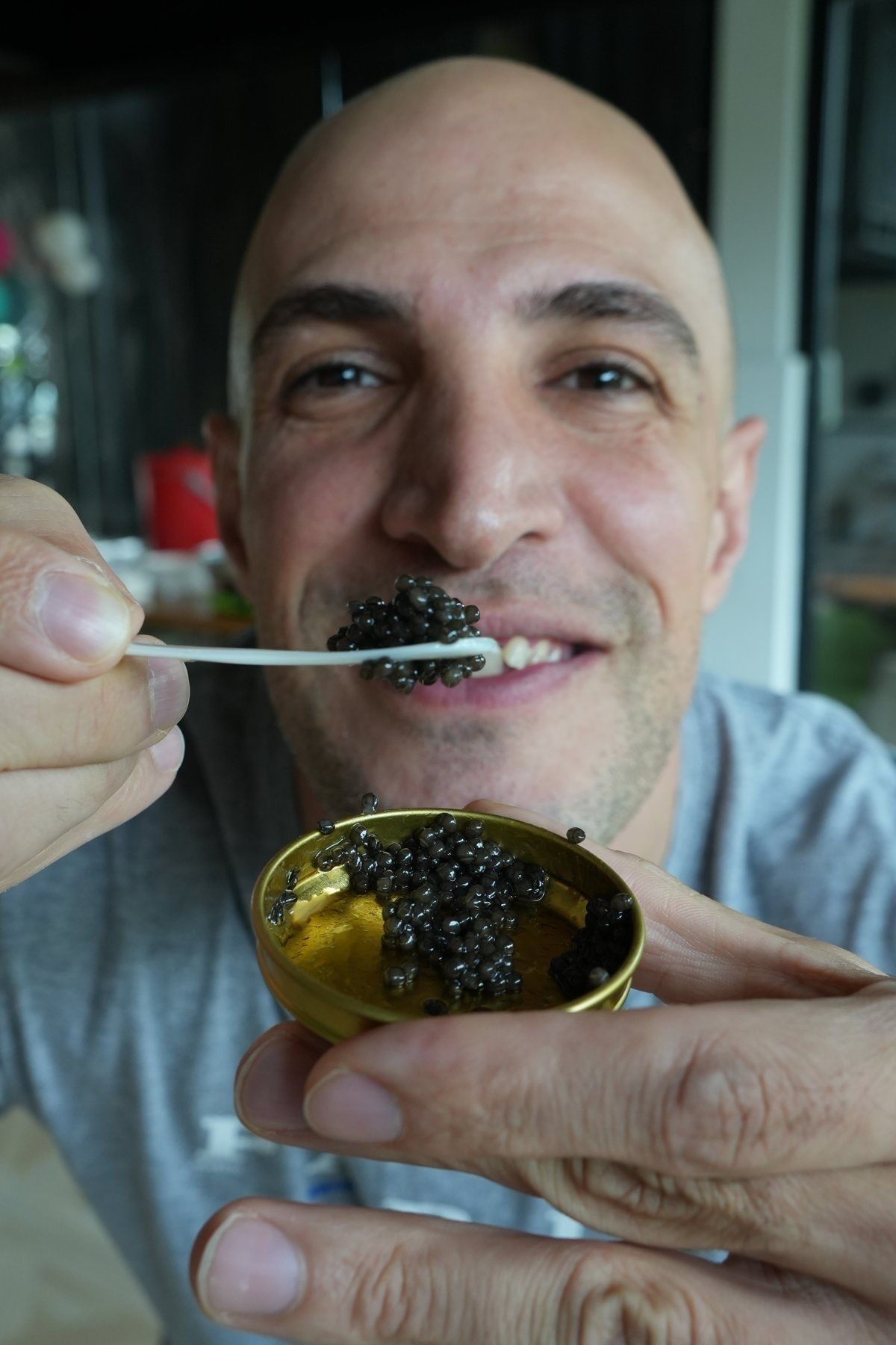 Amin tasting caviar