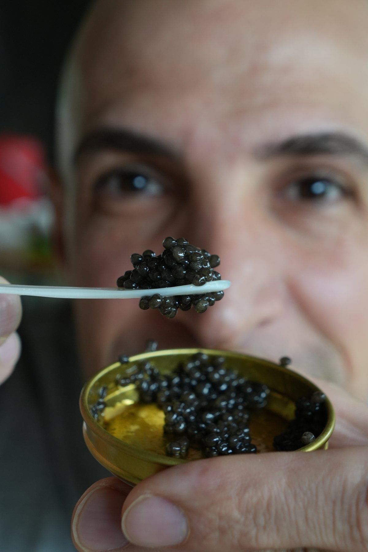 Amin tasting caviar