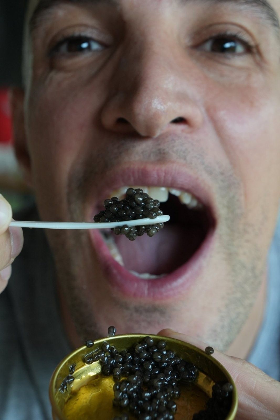 Amin tasting caviar