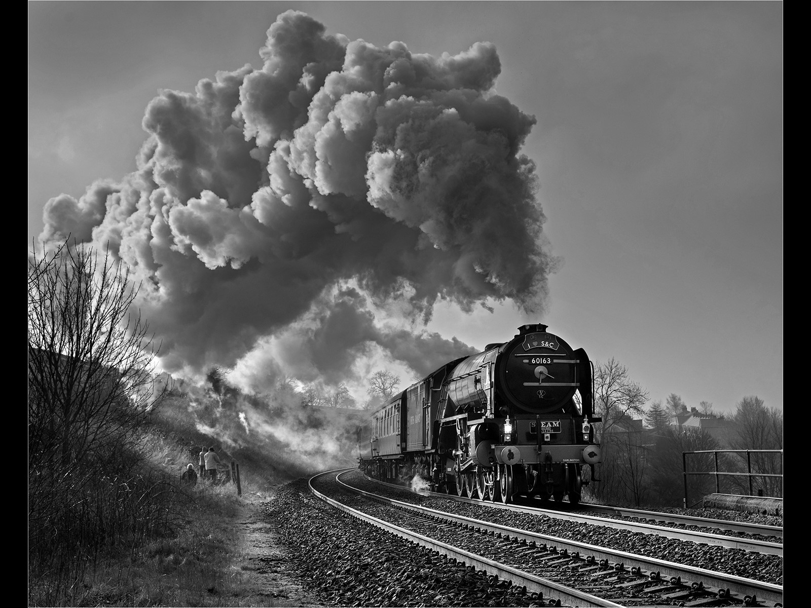 A ray of light catches Tornado passing past Langcliffe.