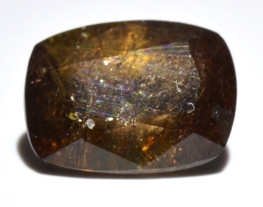 Axinite: Magnetism and Color