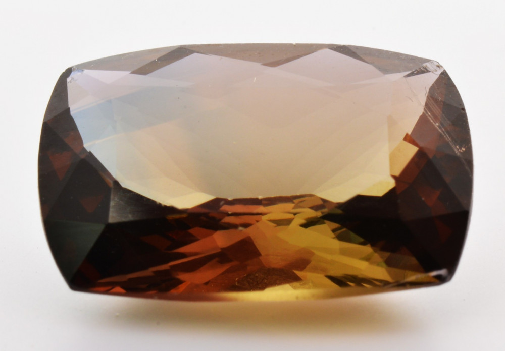 Axinite: Magnetism and Color