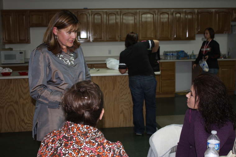 Jeanne Davis (TBC Executive Director's wife) talking with ladies.